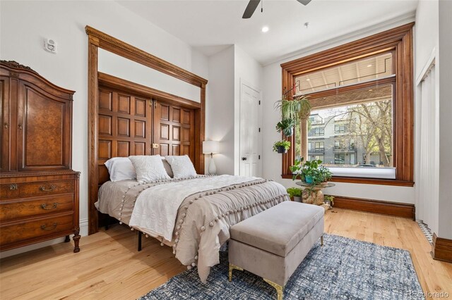 bedroom with light wood-style flooring, baseboards, recessed lighting, and a ceiling fan