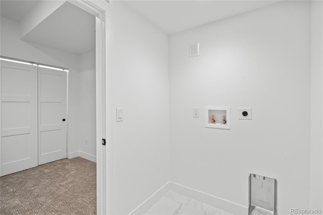 laundry area with laundry area, washer hookup, visible vents, baseboards, and electric dryer hookup