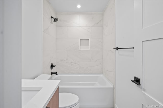 full bathroom featuring vanity, bathtub / shower combination, and toilet