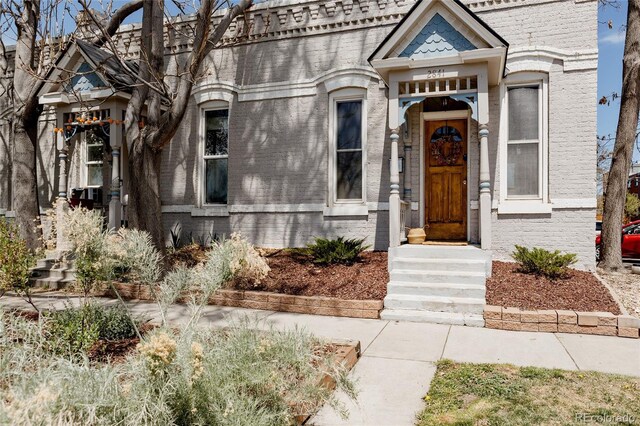 view of front of house with brick siding