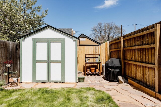 view of shed with a fenced backyard