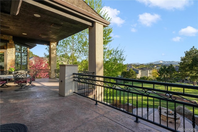 17540 Pond View Pl, Colorado Springs, CO 80908 - view of patio with a balcony and a mountain view