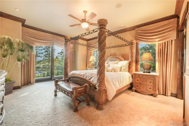 17540 Pond View Pl, Colorado Springs, CO 80908 - carpeted bedroom featuring ornamental molding, access to outside, baseboards, multiple windows, and a ceiling fan