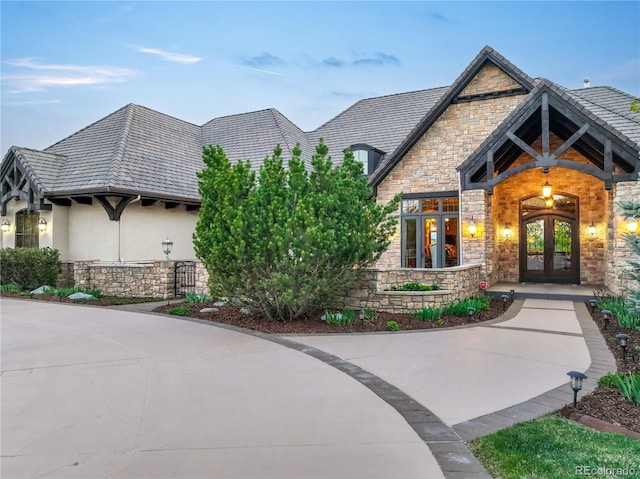 17540 Pond View Pl, Colorado Springs, CO 80908 - view of front of property with stone siding, french doors, and stucco siding