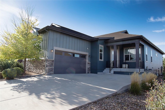 view of front of home featuring covered porch and a garage