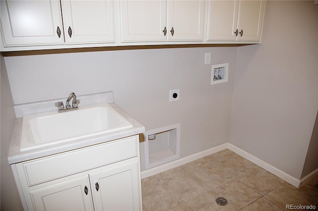 laundry area with hookup for a washing machine, sink, light tile patterned flooring, electric dryer hookup, and cabinets