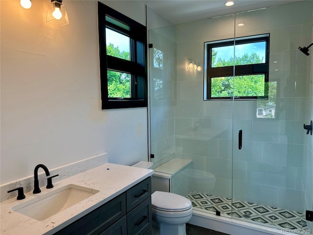 2442 S Saint Paul St, Denver, CO 80210 - bathroom with a stall shower, healthy amount of natural light, and vanity