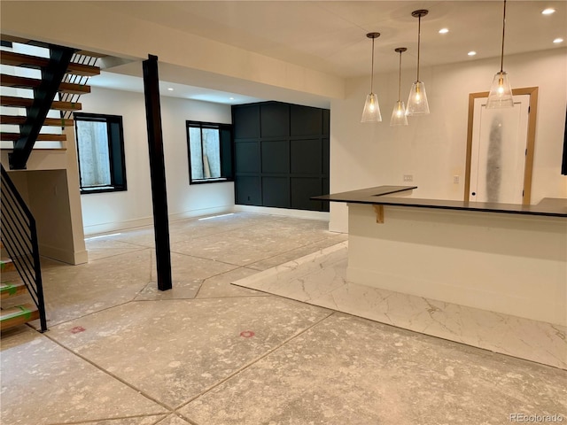 2442 S Saint Paul St, Denver, CO 80210 - below grade area with recessed lighting, inlaid floor details, and stairs