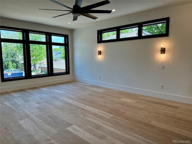 2442 S Saint Paul St, Denver, CO 80210 - spare room with light wood-type flooring, a ceiling fan, and recessed lighting