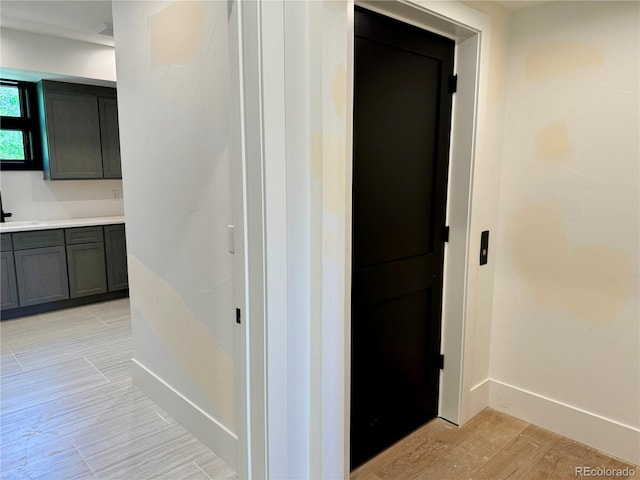 2442 S Saint Paul St, Denver, CO 80210 - corridor with baseboards and light wood finished floors