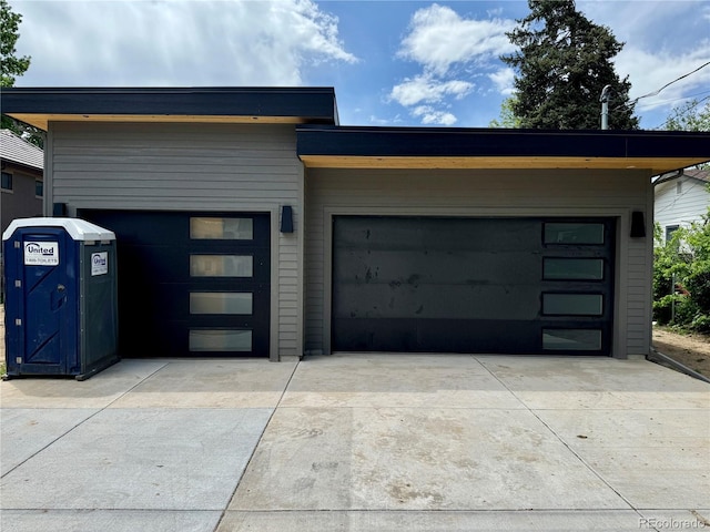 2442 S Saint Paul St, Denver, CO 80210 - garage featuring concrete driveway