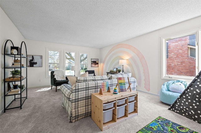 living room with baseboards, a textured ceiling, and light colored carpet