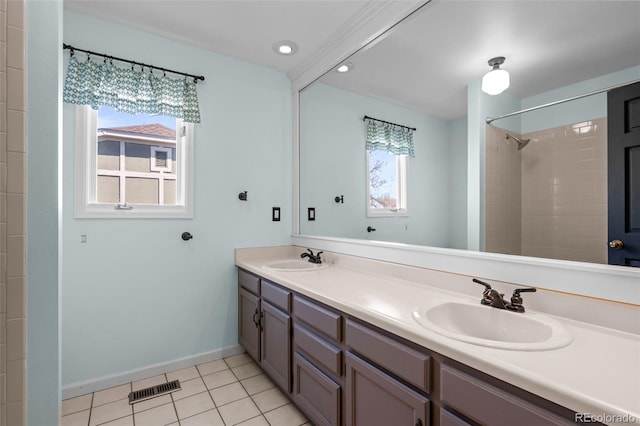bathroom with plenty of natural light, visible vents, and a sink