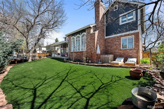 exterior space featuring fence and a deck