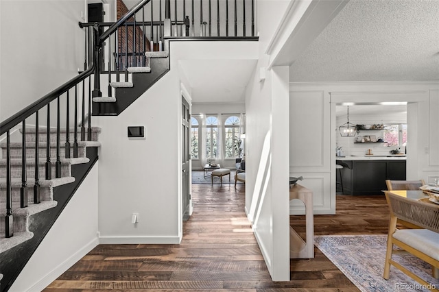 interior space with baseboards and wood finished floors