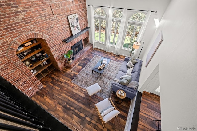 living area featuring a fireplace and wood-type flooring