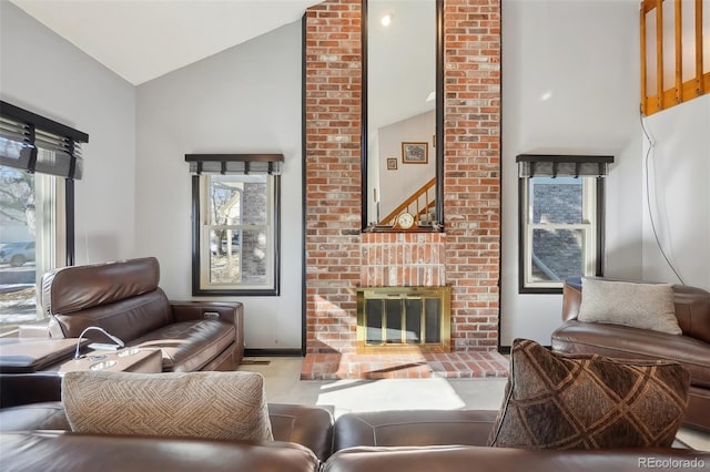 living room with a fireplace and vaulted ceiling