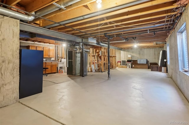 basement with sink and plenty of natural light