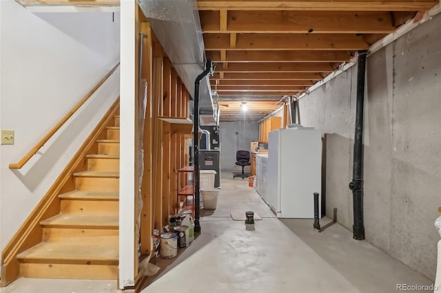 basement featuring white refrigerator