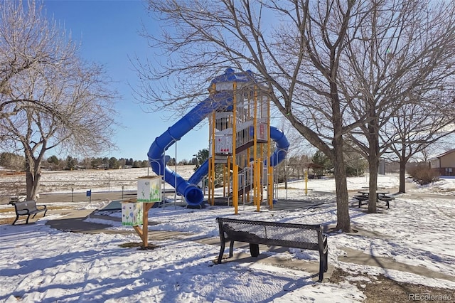 view of property's community with a playground