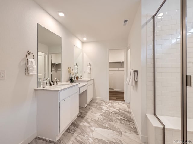 2967 S Quaker St, Morrison, CO 80465 - bathroom featuring a spacious closet, double vanity, a shower stall, marble finish flooring, and recessed lighting