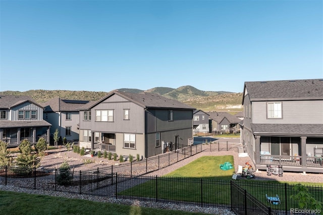 2967 S Quaker St, Morrison, CO 80465 - rear view of property featuring a residential view, a fenced backyard, a mountain view, and a patio