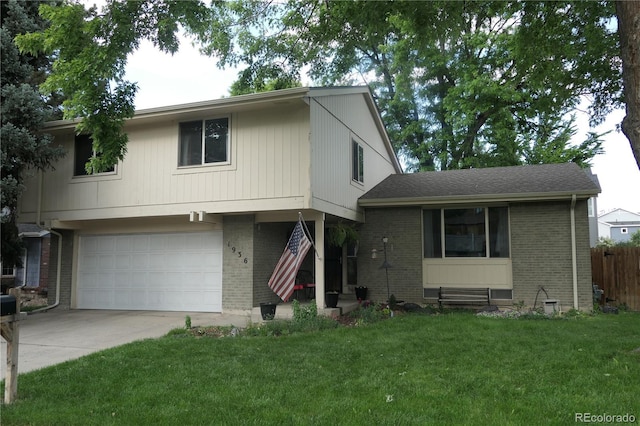 1936 S Poplar St, Denver, CO 80224 - view of front of home featuring brick siding, concrete driveway, and a garage
