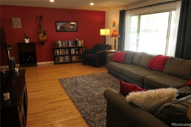 1936 S Poplar St, Denver, CO 80224 - living room with light wood-style floors and recessed lighting