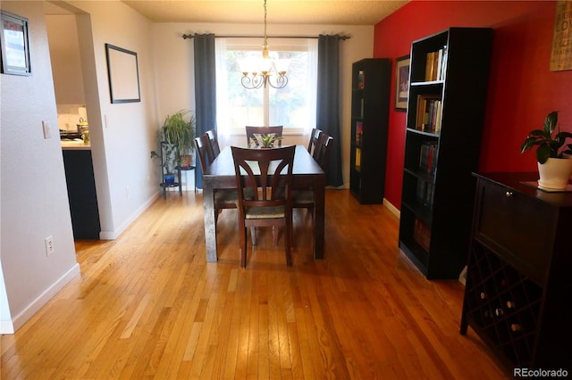 1936 S Poplar St, Denver, CO 80224 - dining space with light wood-style flooring and a chandelier