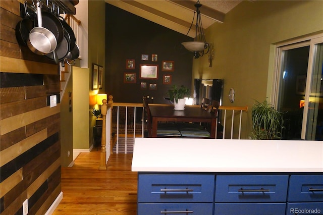 1936 S Poplar St, Denver, CO 80224 - kitchen with blue cabinets, wood finished floors, and light countertops