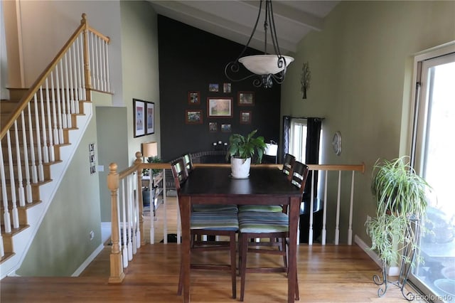 1936 S Poplar St, Denver, CO 80224 - dining room with wood finished floors, high vaulted ceiling, stairs, and beam ceiling
