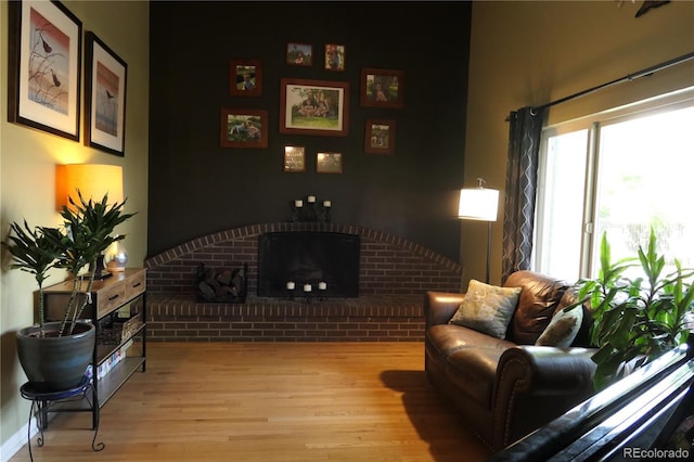 1936 S Poplar St, Denver, CO 80224 - living room featuring wood finished floors and a fireplace
