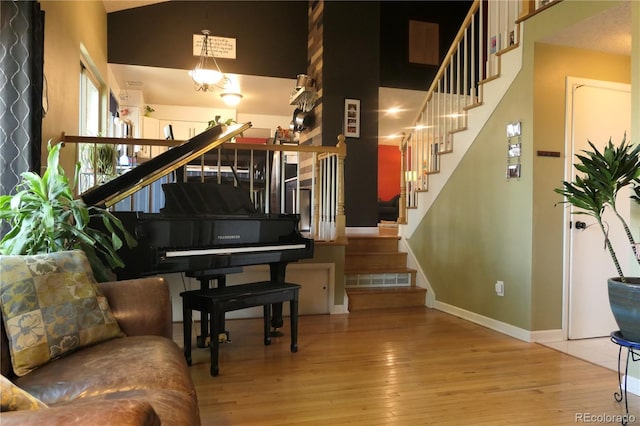 1936 S Poplar St, Denver, CO 80224 - stairs featuring wood-type flooring and a towering ceiling