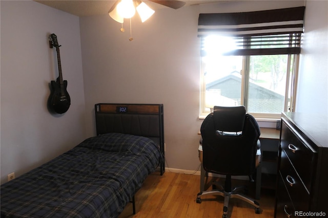 1936 S Poplar St, Denver, CO 80224 - bedroom featuring light wood-type flooring and a desk