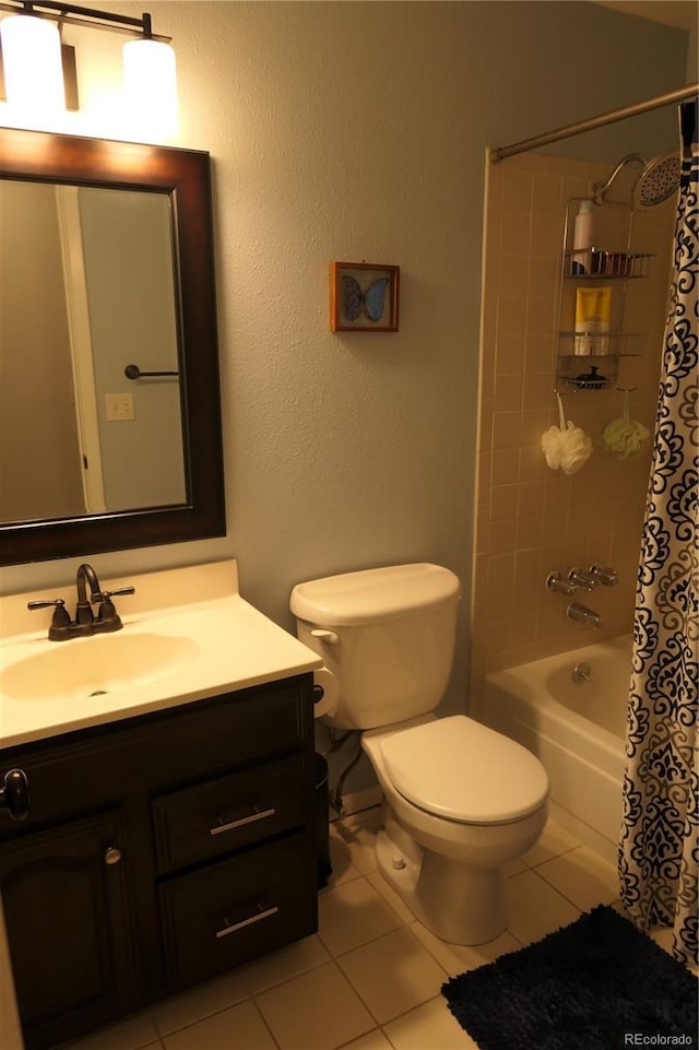 1936 S Poplar St, Denver, CO 80224 - bathroom featuring vanity, tile patterned floors, and shower / bath combo with shower curtain