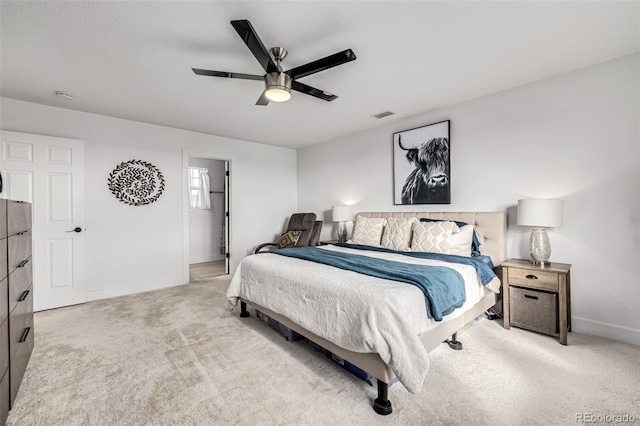 bedroom featuring ceiling fan and light carpet