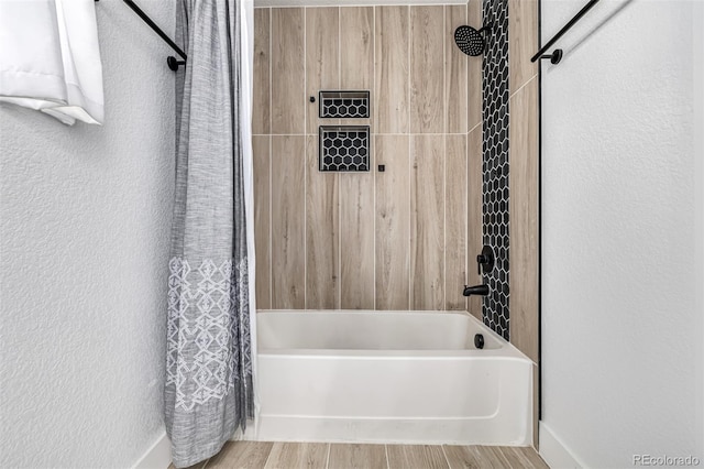 bathroom featuring shower / bathtub combination with curtain and wood-type flooring