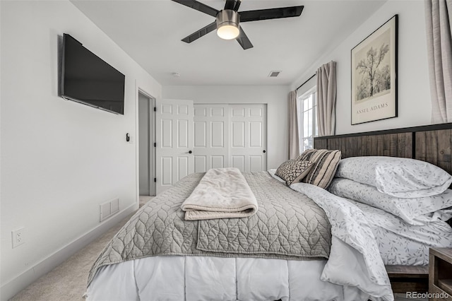 bedroom with carpet floors, a closet, and ceiling fan