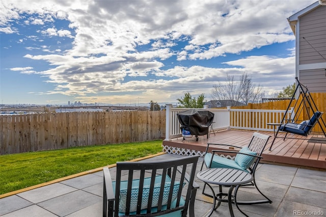 view of patio featuring grilling area and a deck