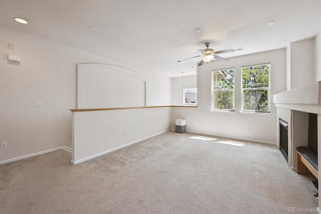 14197 W 84th Cir Unit C, Arvada, CO 80005 - unfurnished living room featuring ceiling fan, carpet flooring, and a fireplace