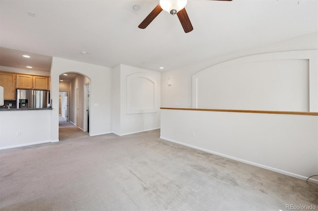 14197 W 84th Cir Unit C, Arvada, CO 80005 - unfurnished living room with arched walkways, a ceiling fan, light colored carpet, and recessed lighting