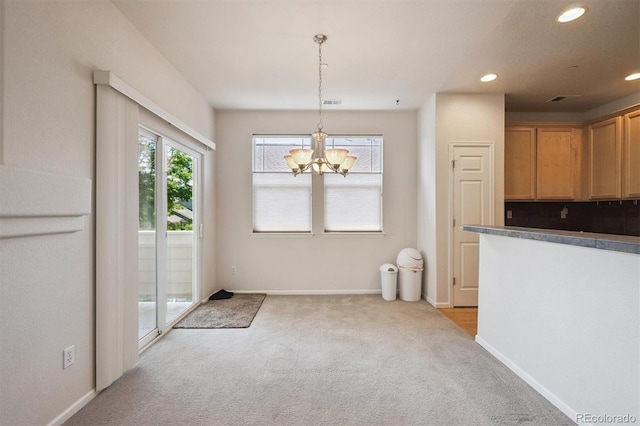 14197 W 84th Cir Unit C, Arvada, CO 80005 - unfurnished dining area featuring light carpet, recessed lighting, and a chandelier