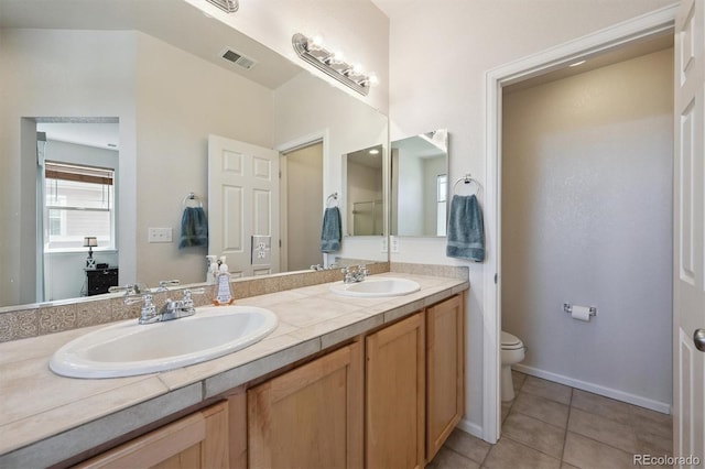 14197 W 84th Cir Unit C, Arvada, CO 80005 - bathroom featuring double vanity and tile patterned flooring