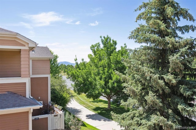 14197 W 84th Cir Unit C, Arvada, CO 80005 - exterior space with roof with shingles, a downspout, and gutters