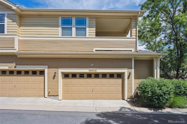 14197 W 84th Cir Unit C, Arvada, CO 80005 - view of home's exterior featuring an attached garage