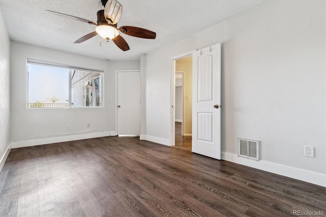 1820 Newland Ct Unit 210, Lakewood, CO 80214 - unfurnished bedroom with dark wood-style flooring, a textured ceiling, baseboards, and ceiling fan