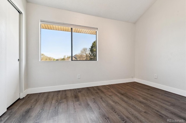1820 Newland Ct Unit 210, Lakewood, CO 80214 - unfurnished bedroom featuring multiple windows, wood finished floors, and baseboards