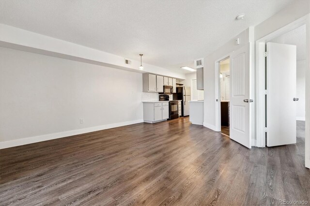 1820 Newland Ct Unit 210, Lakewood, CO 80214 - unfurnished living room with dark wood-style floors and baseboards