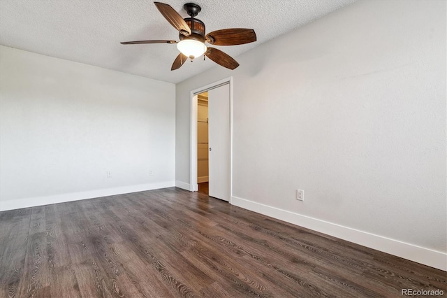 1820 Newland Ct Unit 210, Lakewood, CO 80214 - unfurnished room with dark wood-style floors, ceiling fan, baseboards, and a textured ceiling