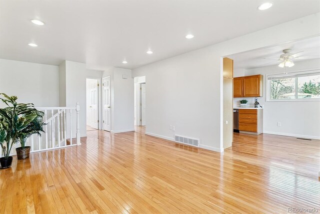 7158 W Roxbury Ave, Littleton, CO 80128 - spare room featuring light wood-type flooring, visible vents, and ceiling fan